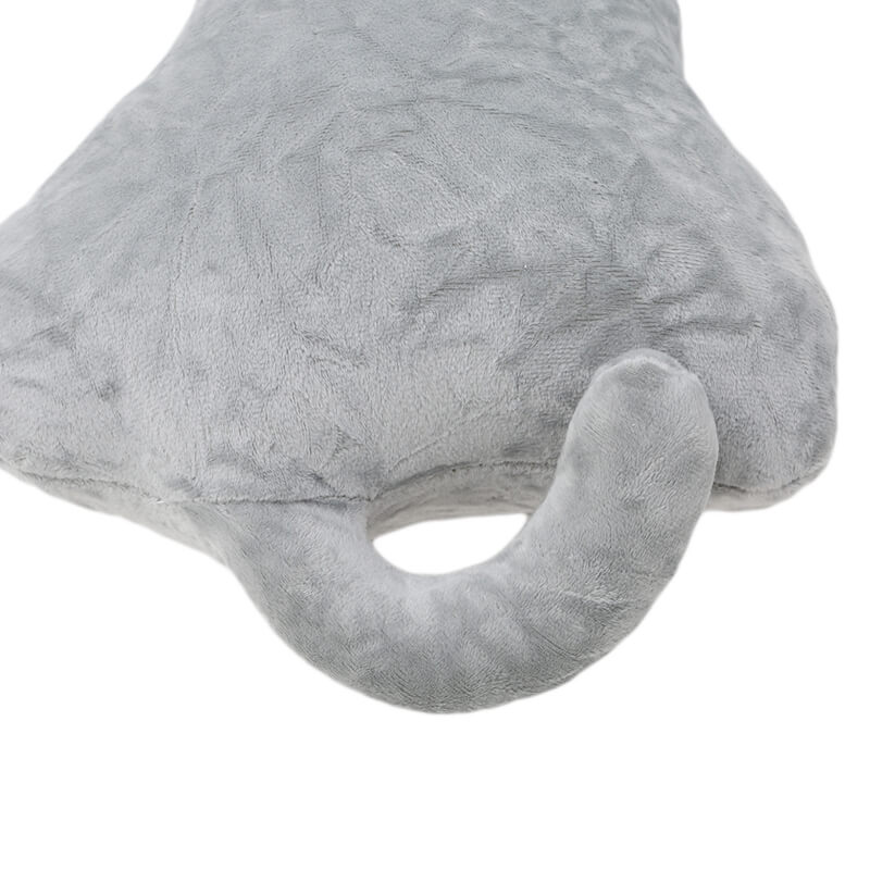 close up of gray decorative cat pillow