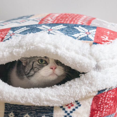 Cat hiding in a Nordic Fair Isle Covered Cat Bed