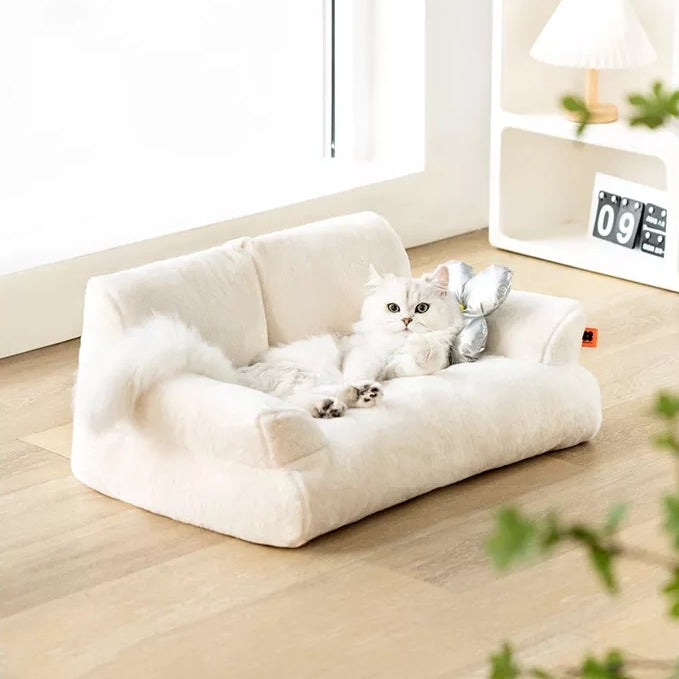 Cat lying on a Mini White Cat Couch
